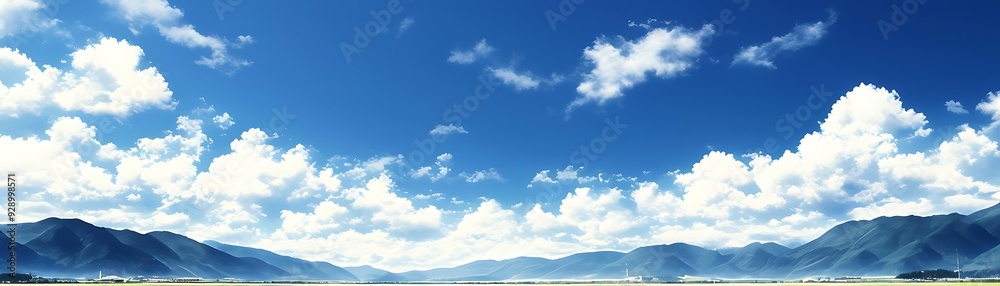 Mountain Range and Blue Sky with White Fluffy Clouds Photo Mountain Range and Blue Sky with White Fluffy Clouds Photo