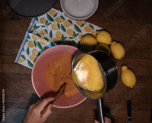 Chesese cake  base micxing  crushed  biscuits and  butter  photo