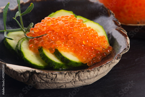 Appetizer. Cucumber with salmon trout caviar