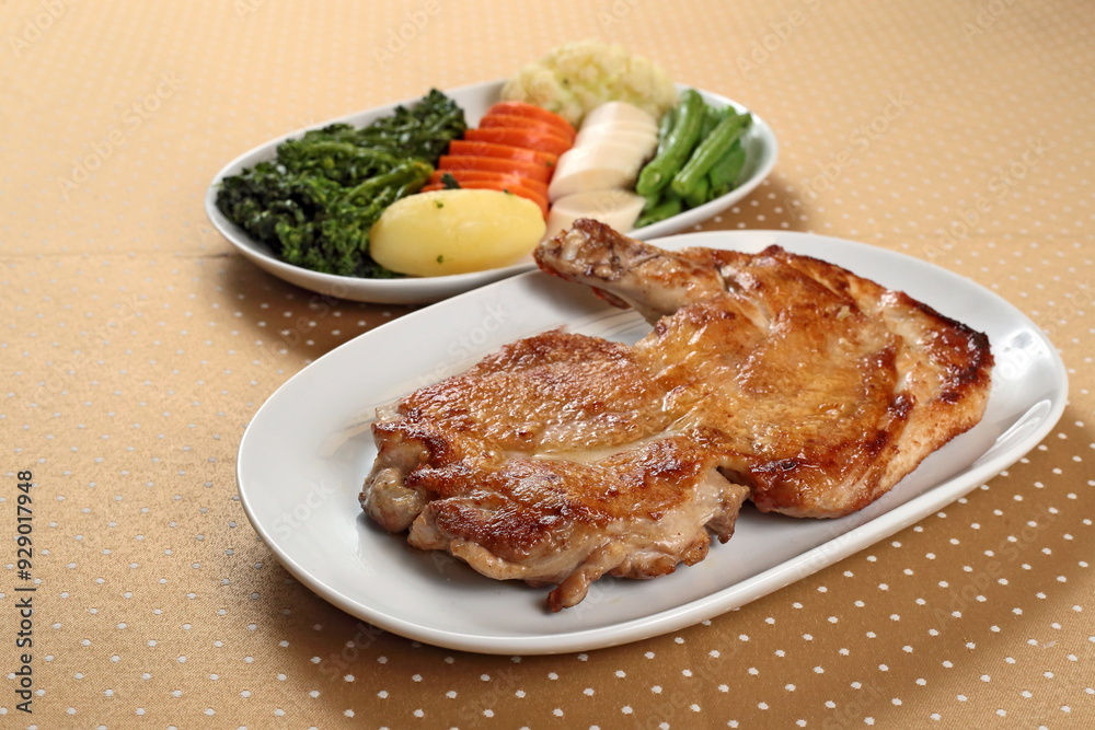 Grilled Capon Chicken with Vegetables on a plate Grilled Capon Chicken with Vegetables on a plate