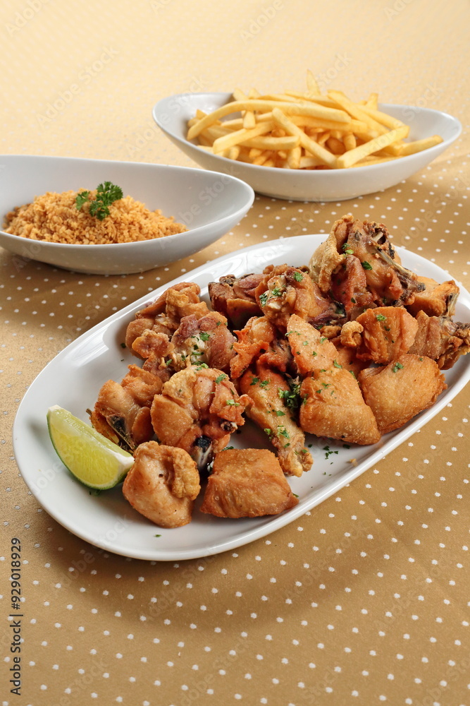 Chicken a little bird with Aglio e Olio with fries and fried garlic Chicken a little bird with Aglio e Olio with fries and fried garlic