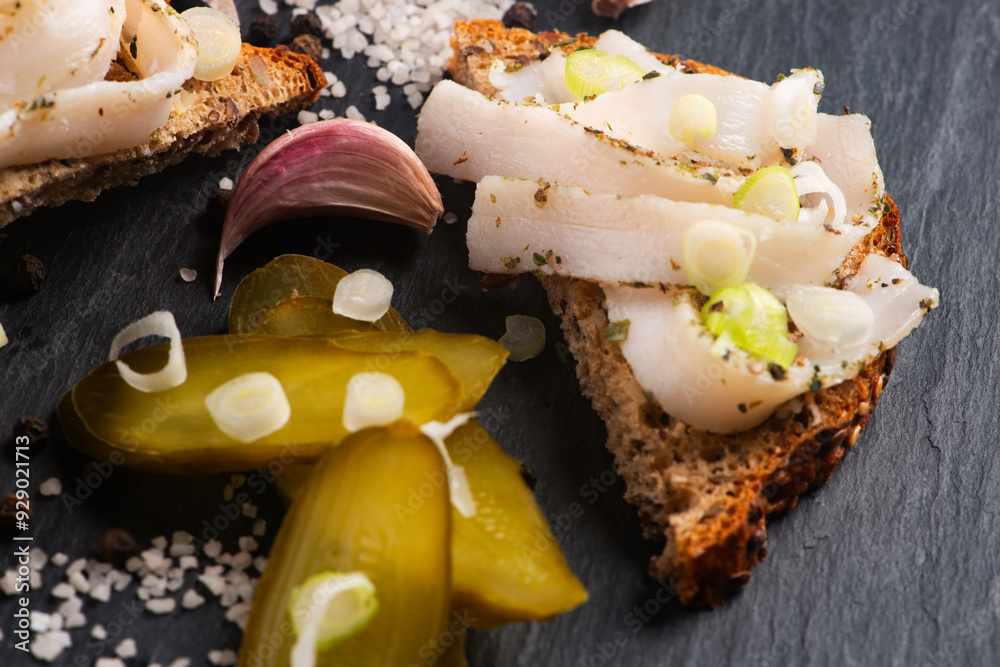 Obraz premium Tasty sandwich with salted lard (salo). Tasty sandwich with salted pork lard (salo),traditional Ukrainian cuisine