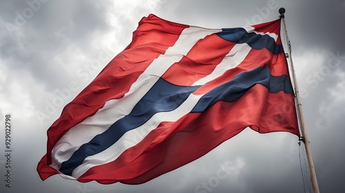 The massive Norway flag against the overcast sky