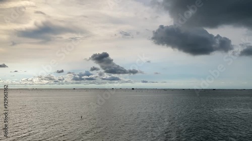 The lapse beautiful clouds over the sea after rain. Abstract blue and dark sky with ocean