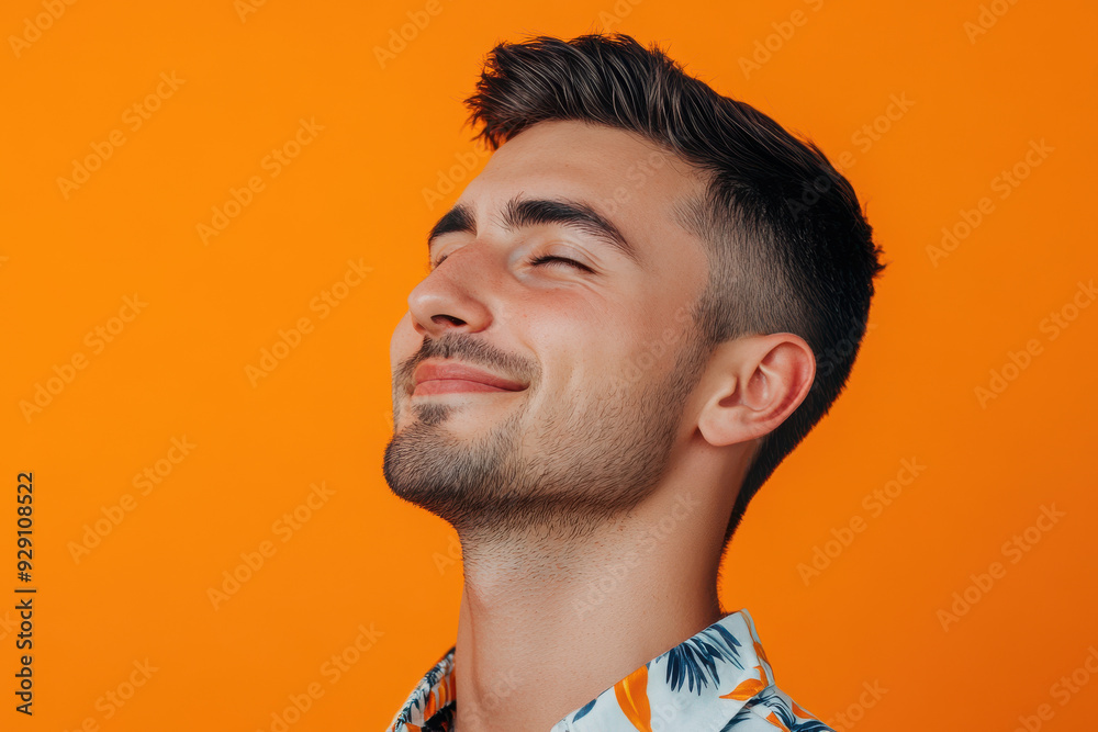 Obraz premium A close up of a man's face with his eyes closed