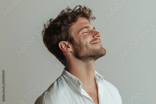 A close up of a man's face with his eyes closed