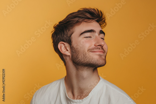 A close up of a man's face with his eyes closed