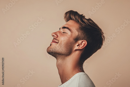 A close up of a man's face with his eyes closed