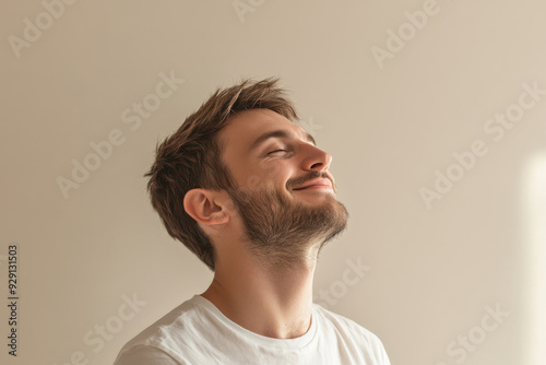 A close up of a man's face with his eyes closed