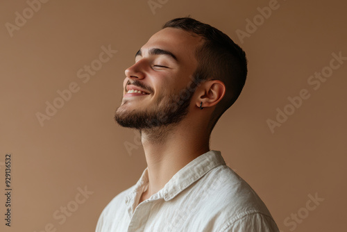 A close up of a man's face with his eyes closed