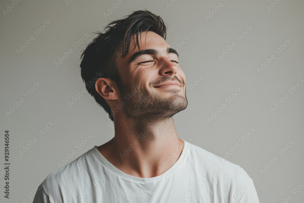 Obraz premium A close up of a man's face with his eyes closed