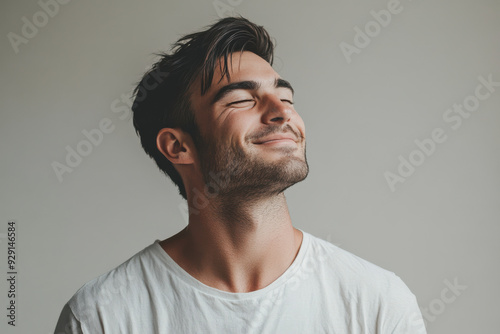 A close up of a man's face with his eyes closed