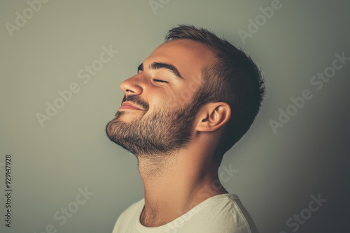 A close up of a man's face with his eyes closed