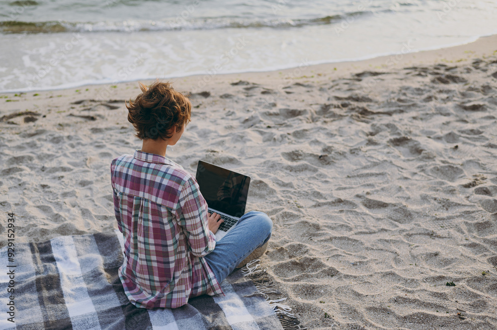 Φωτογραφία Full body young IT woman wear shirt casual clothes work hold use blank screen laptop pc computer sitting rest on sea ocean sand shore beach outdoor seaside in summer day free time