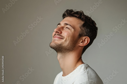 A close up of a man's face with his eyes closed