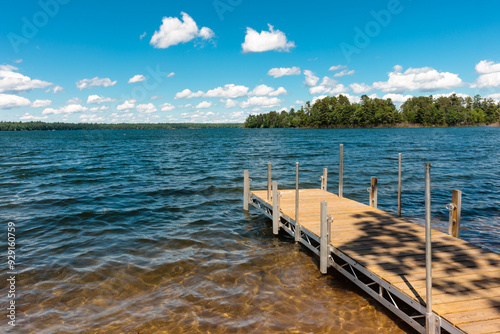 A perfect day to stand and feel the breezes on the pier at the Big Muskellunge Lake near Sayner, Wisconsin in mid-June photo