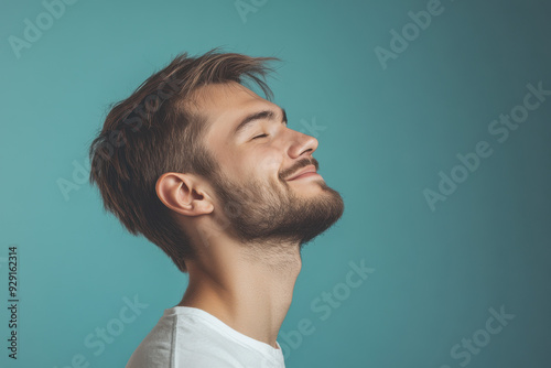 A close up of a man's face with his eyes closed