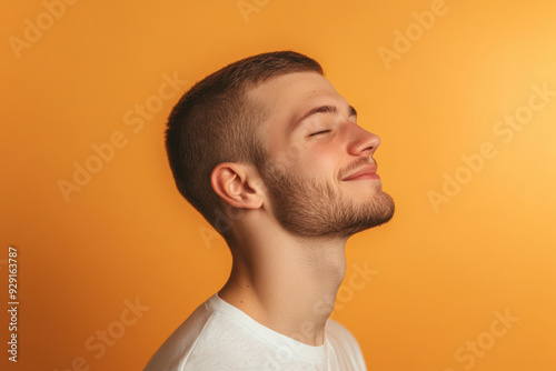 A close up of a man's face with his eyes closed