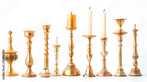 a collection of gold candle holders on white background