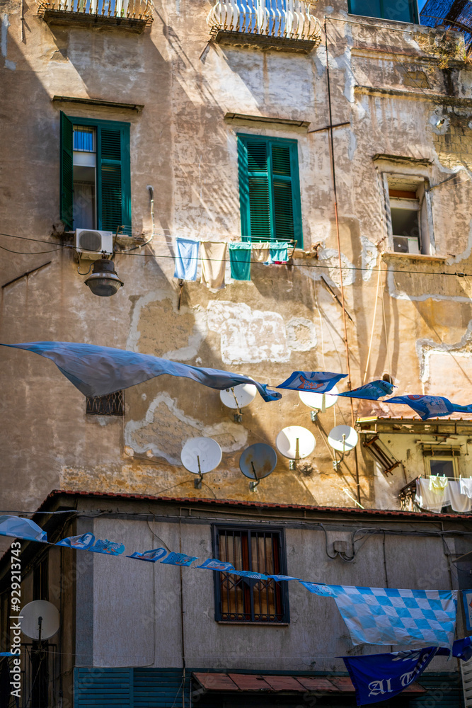 Urban Residential Building with Laundry and Satellite Dishes, beautiful colorful view on a typical building in Naples, Italy