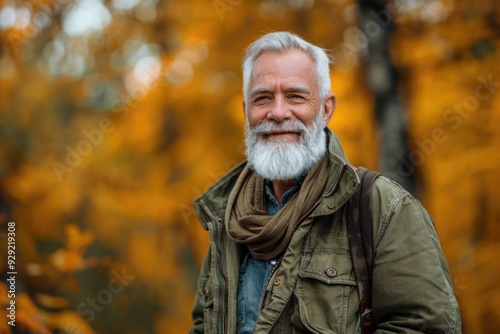 A man with a long white beard wears a bright green jacket, ready for an adventure