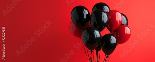 Bunch of black and red balloons floating on red background Black Friday