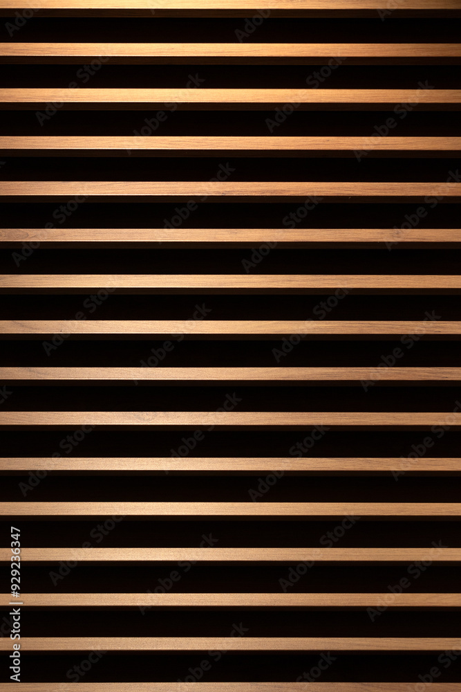 Abstract view of horizontal dark and light wooden slats for use as background texture 