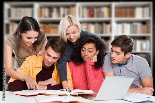 Group of students study materials in school library