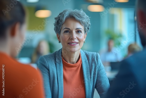 Experienced HR Adviser Leading Employee Engagement Recruitment Meeting in Modern Vibrant Office