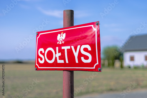 Polish information board reading "Soltys", meaning "village mayor" or "the chair of a village council".