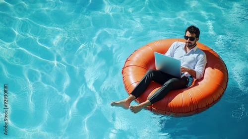 A man of Middle-Eastern descent relaxes on an inflatable ring, working on his laptop in a clear blue pool.