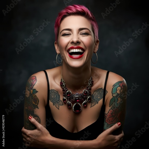 smiling woman, vibrant laughter, short pink hair, bold red lipstick, tattooed shoulders, large hoop earrings, expressive joy, dark background, studio portrait, high contrast, sharp details, elegant je photo