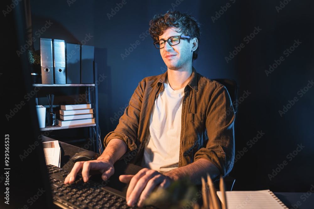 Young businessman tying on pc for creative startup project job next planner at neon light modern office. Thinking marketing network online planning of creator to market channel design concept. Gusher. Young businessman tying on pc for creative startup project job next planner at neon light modern office. Thinking marketing network online planning of creator to market channel design concept. Gusher.