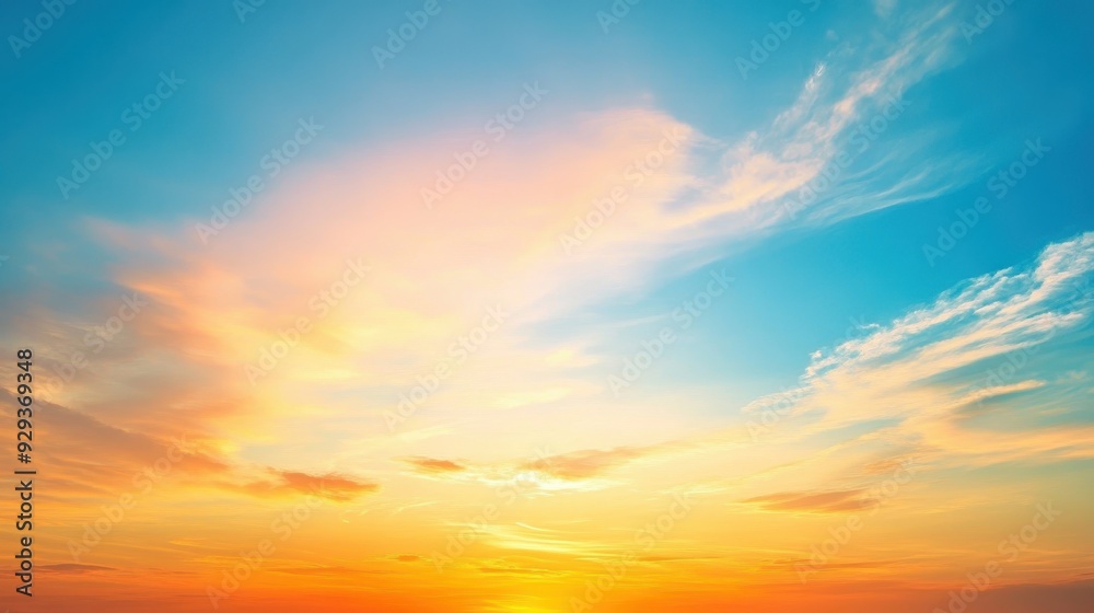 Fototapeta premium A serene sunset sky with vibrant colors blending into clouds.