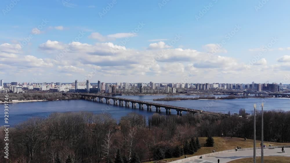 Aerial drone view from above view of Mother Ukraine, Mother Motherland, a monumental Soviet-era statue in Kyiv, the capital of Ukraine. View of the Dnipro river and the left bank, bridge and houses
Aerial drone view from above view of Mother Ukraine, Mother Motherland, a monumental Soviet-era statue in Kyiv, the capital of Ukraine. View of the Dnipro river and the left bank, bridge and houses