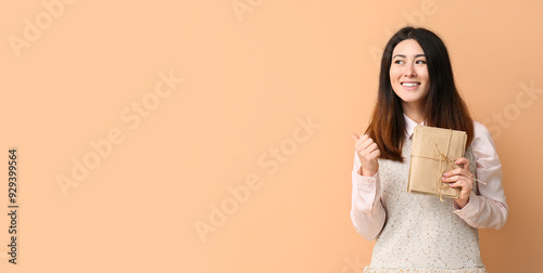 Young Asian woman with stac...