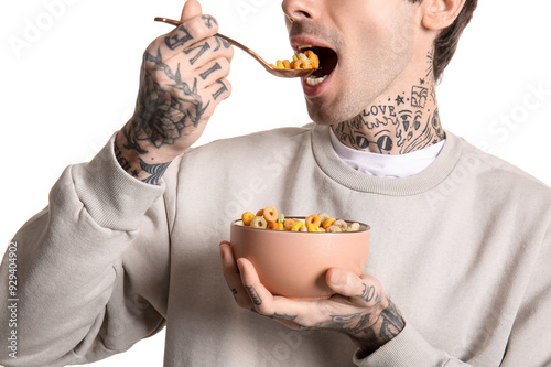 Man eating cereal rings on ...