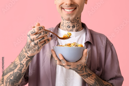 Man holding bowl with cerea...