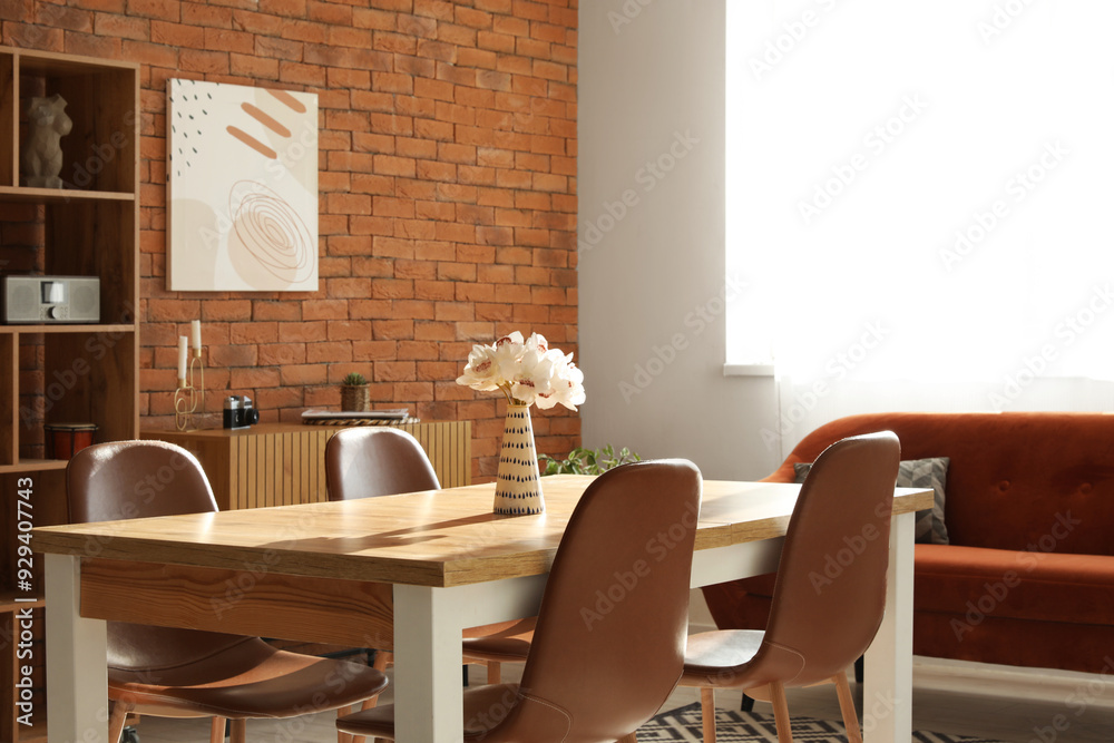 Living room in loft style with sofa, table and chairs Living room in loft style with sofa, table and chairs