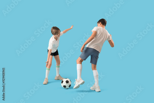 Happy brothers playing foot...