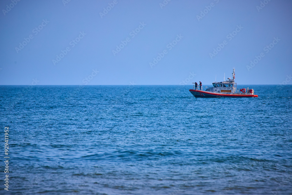 Coast Guard Patrol Boat on Calm Lake Michigan from Low Vantage Point Coast Guard Patrol Boat on Calm Lake Michigan from Low Vantage Point