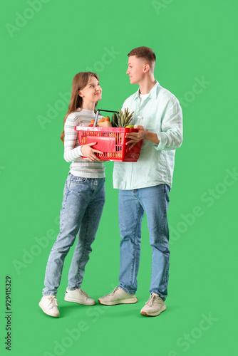 Young couple with full shop...
