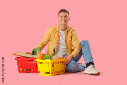 Young man with full shoppin...