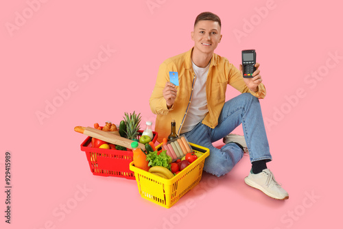 Young man with credit card,...