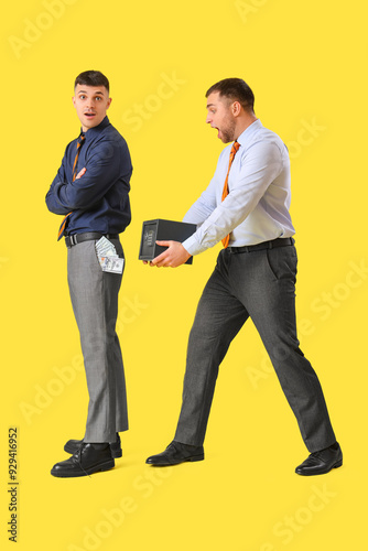 Shocked young men with safe...