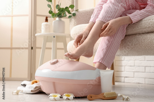 Woman with massage foot bat...