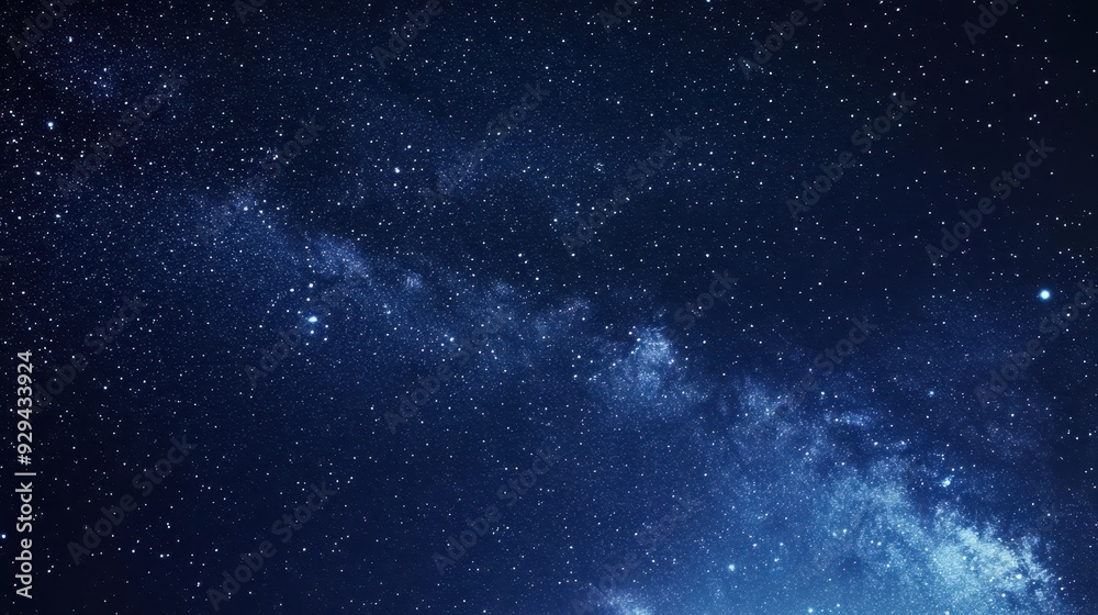 Naklejka premium A stunning view of the night sky filled with stars and the Milky Way galaxy.