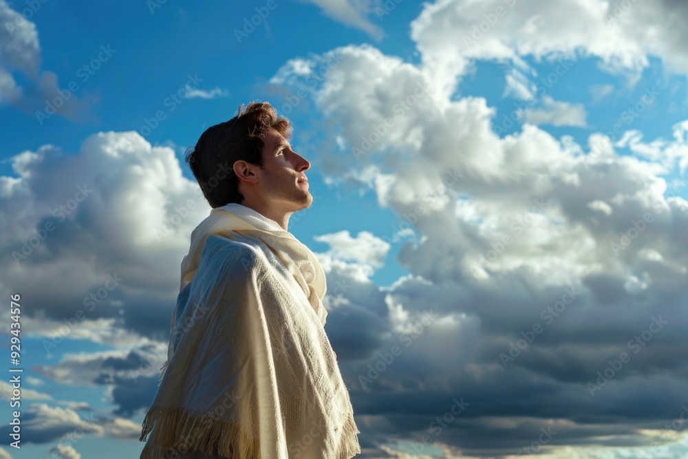 A person standing outdoors on a cloudy day with a clear blue sky above A person standing outdoors on a cloudy day with a clear blue sky above