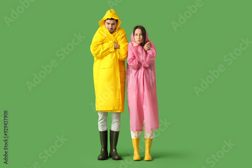 Frozen young couple in rain...
