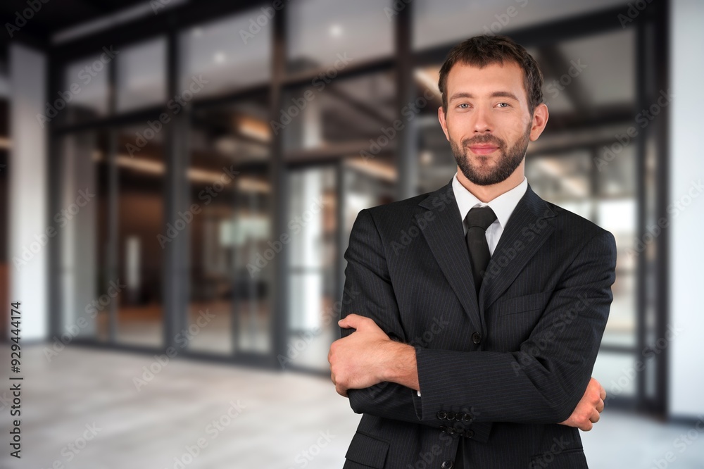 Happy professional businessman posing in office Happy professional businessman posing in office